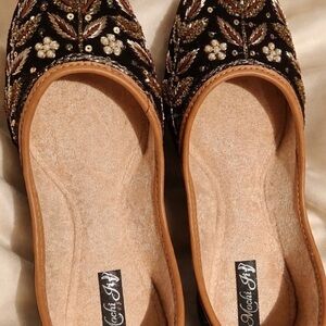 Embellished Black Jutti Flats with Gold Beadwork